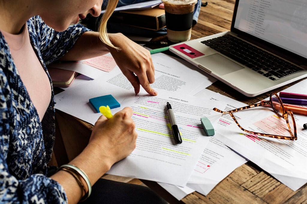 Professional translator reviewing documents for a spouse visa translation request